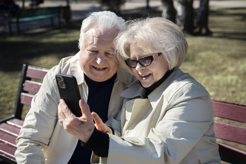 medium-shot-senior-people-taking-selfie